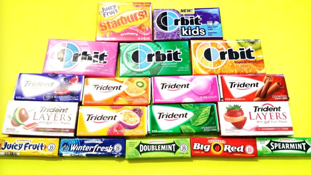 a group of different colored packages of chewing gum