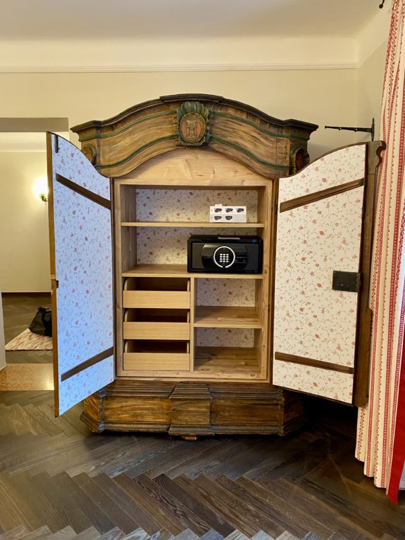 a wooden cabinet with open doors