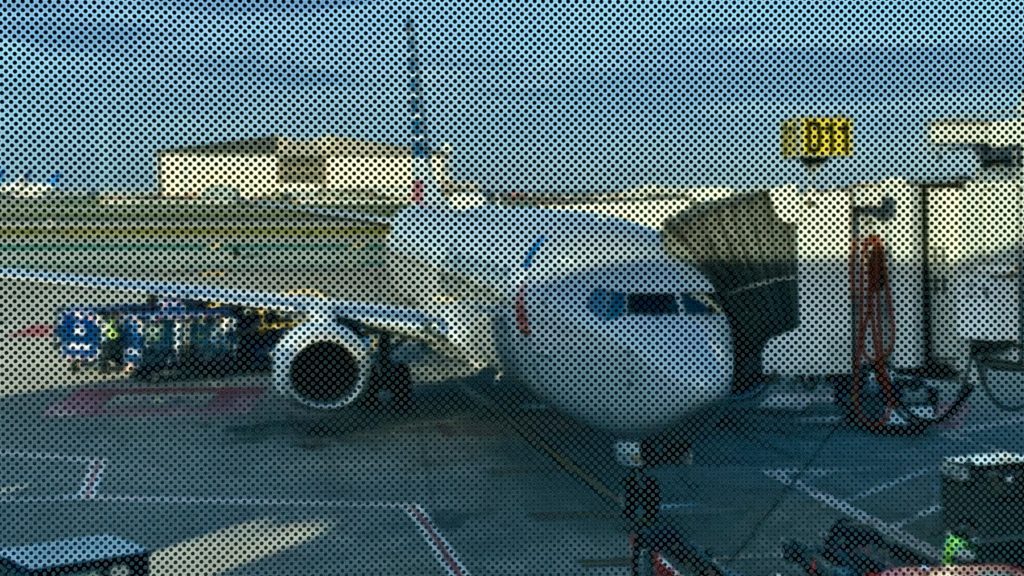 a plane is parked at the airport