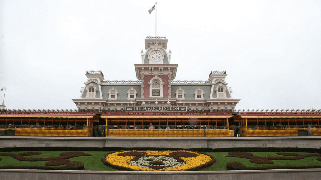 a building with a clock tower and a train