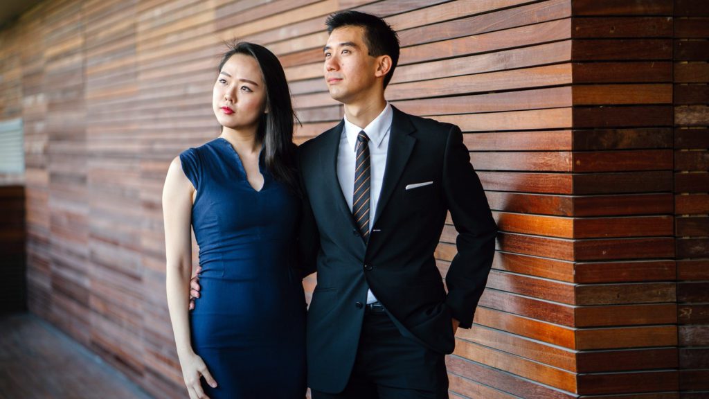 a man and woman standing next to each other