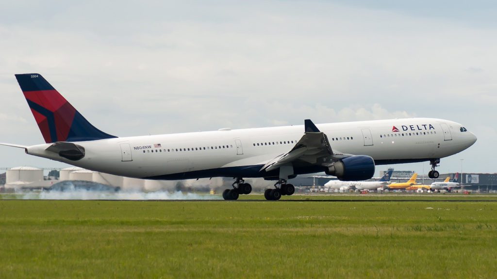 a large white airplane on a runway