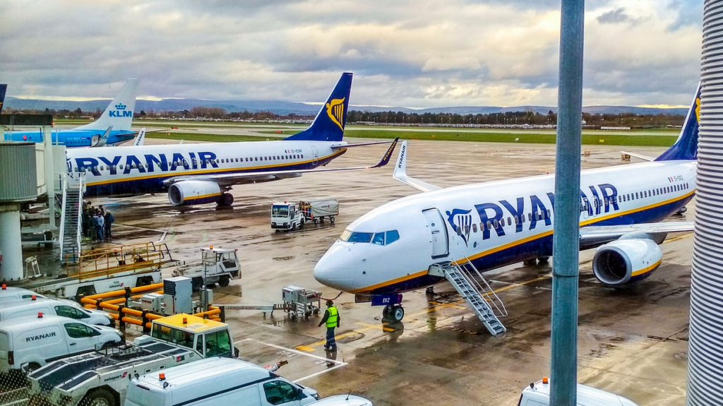 a group of airplanes at an airport