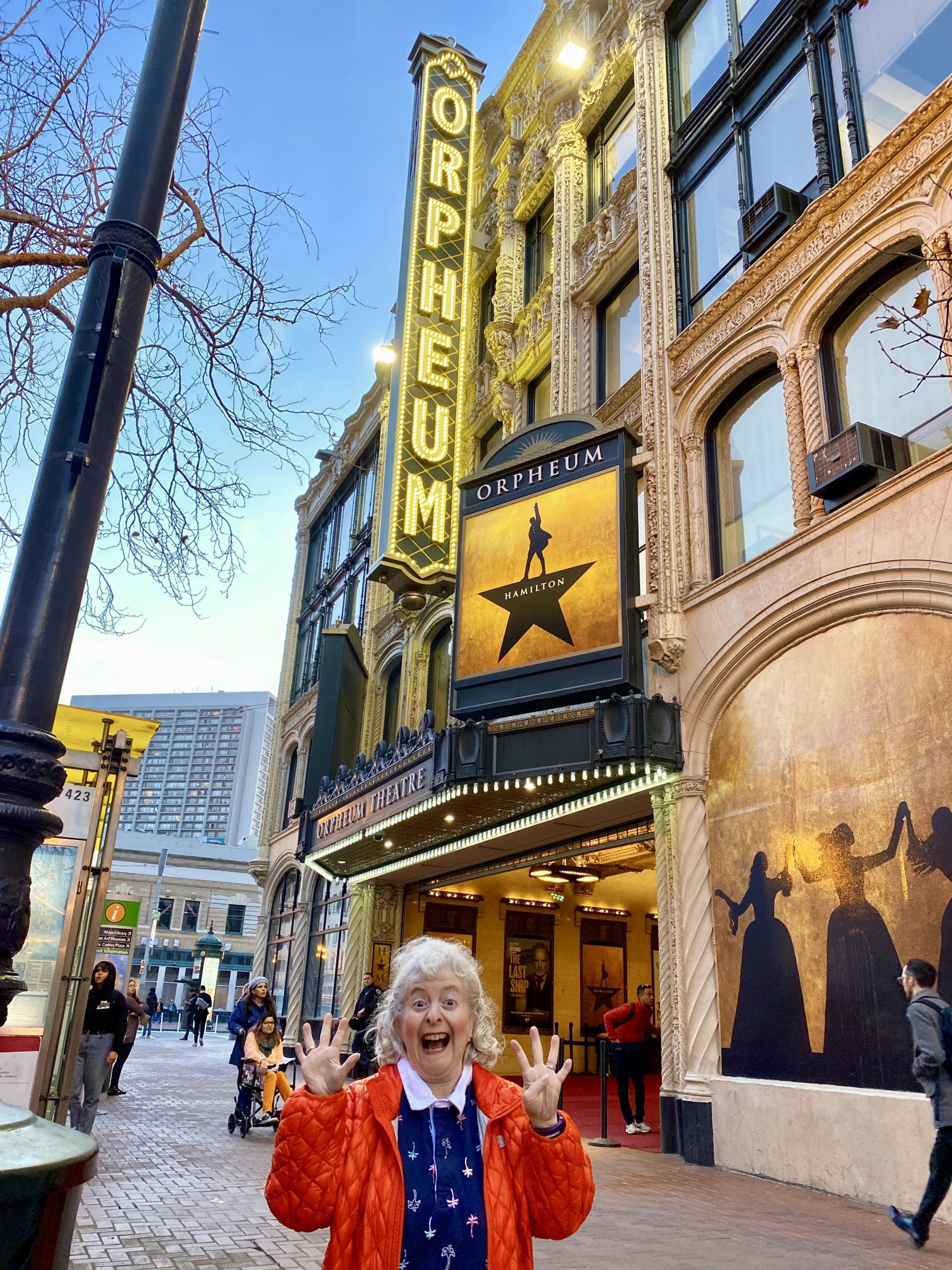 a woman standing in front of a building