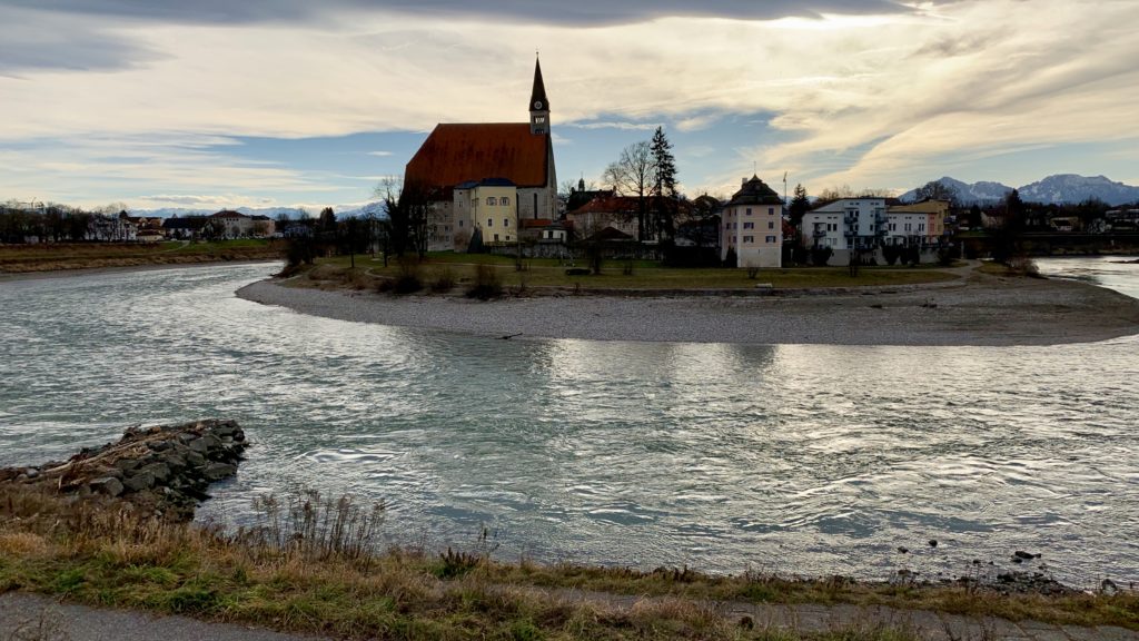 a river with buildings and trees