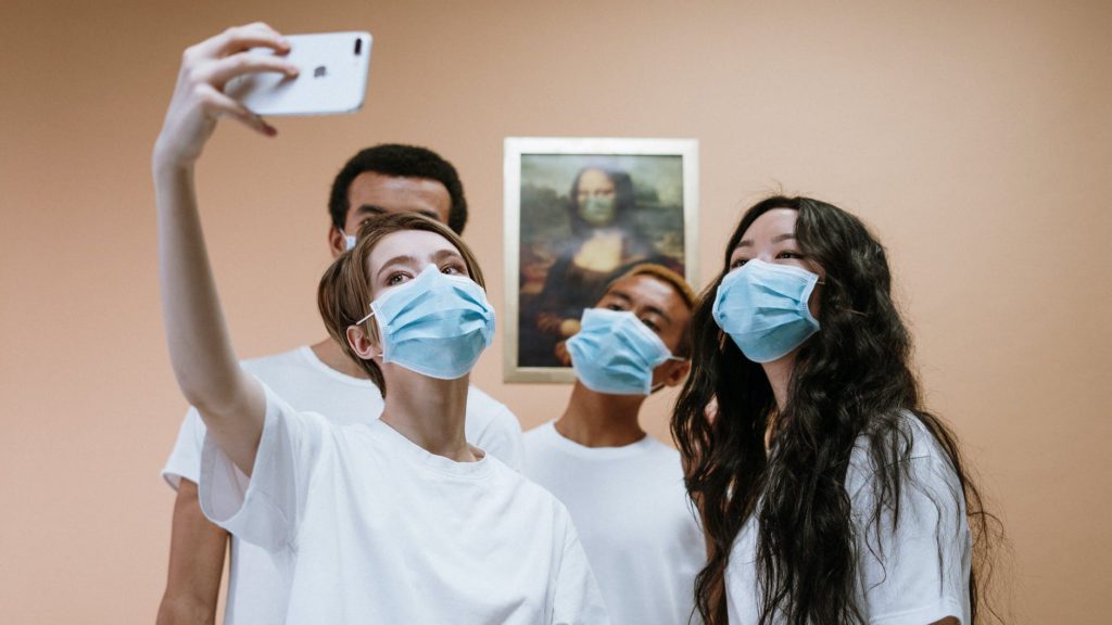 a group of people wearing face masks