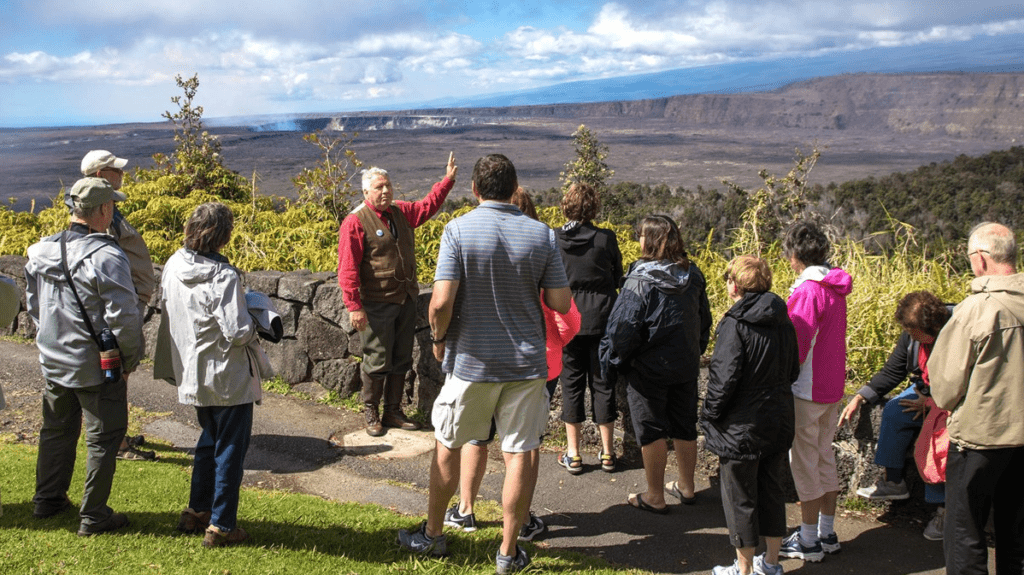 a group of people standing on a path looking at a landscape