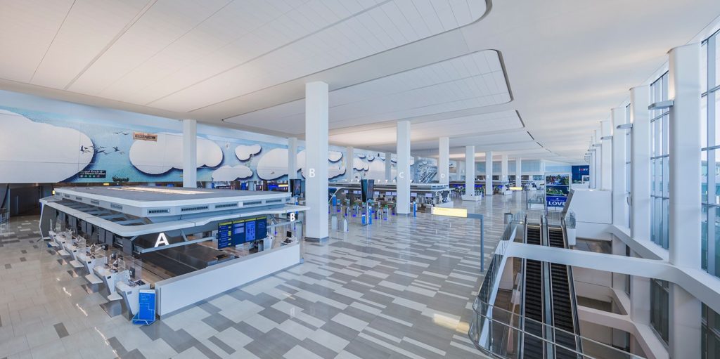 a large white and blue airport terminal