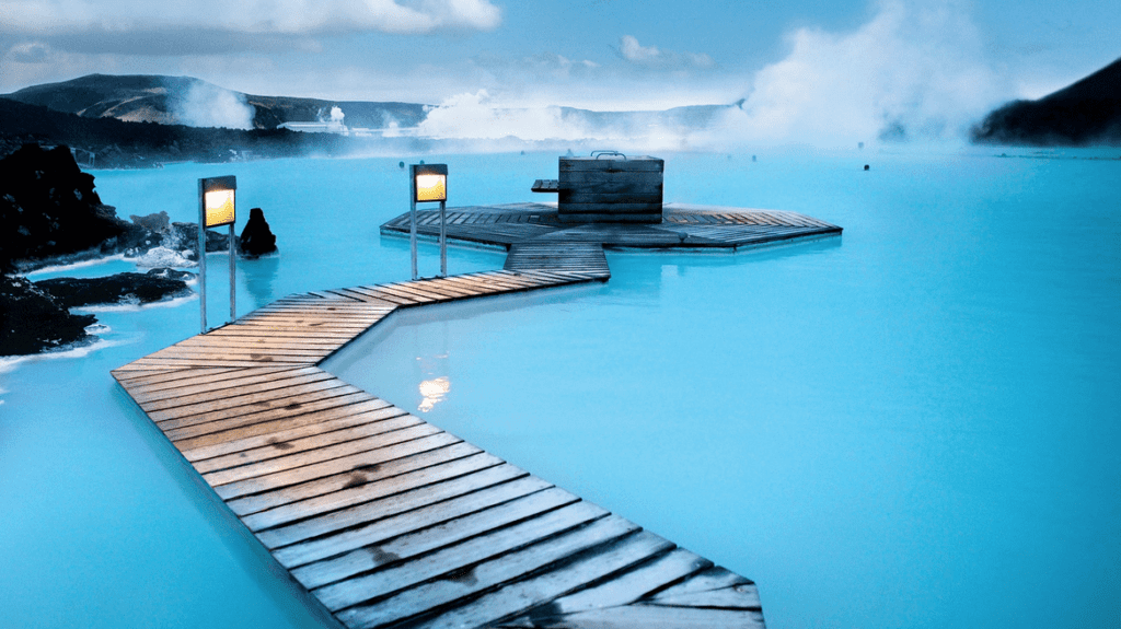 a wooden walkway leading to a hot spring