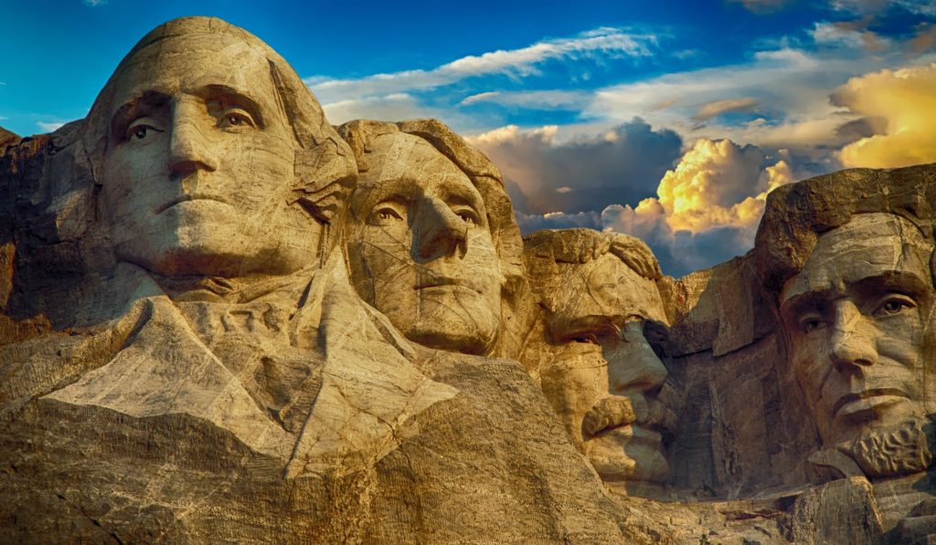 a group of stone sculptures of presidents