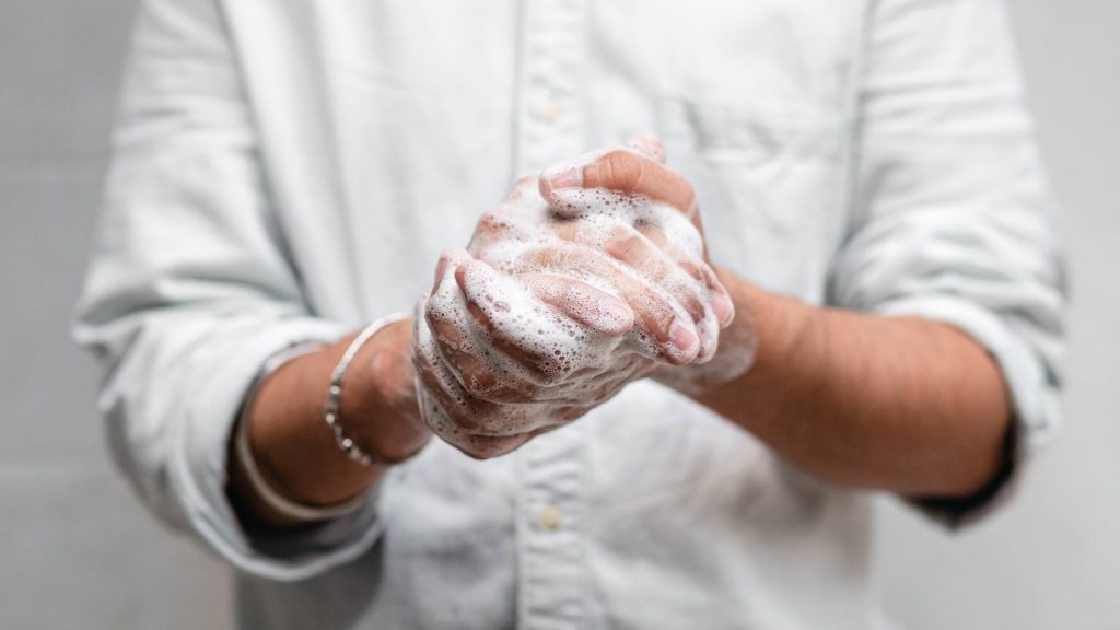 a person washing their hands