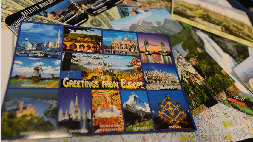 a group of postcards on a table