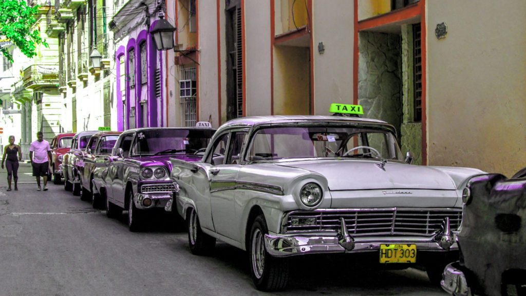 a group of cars parked on a street