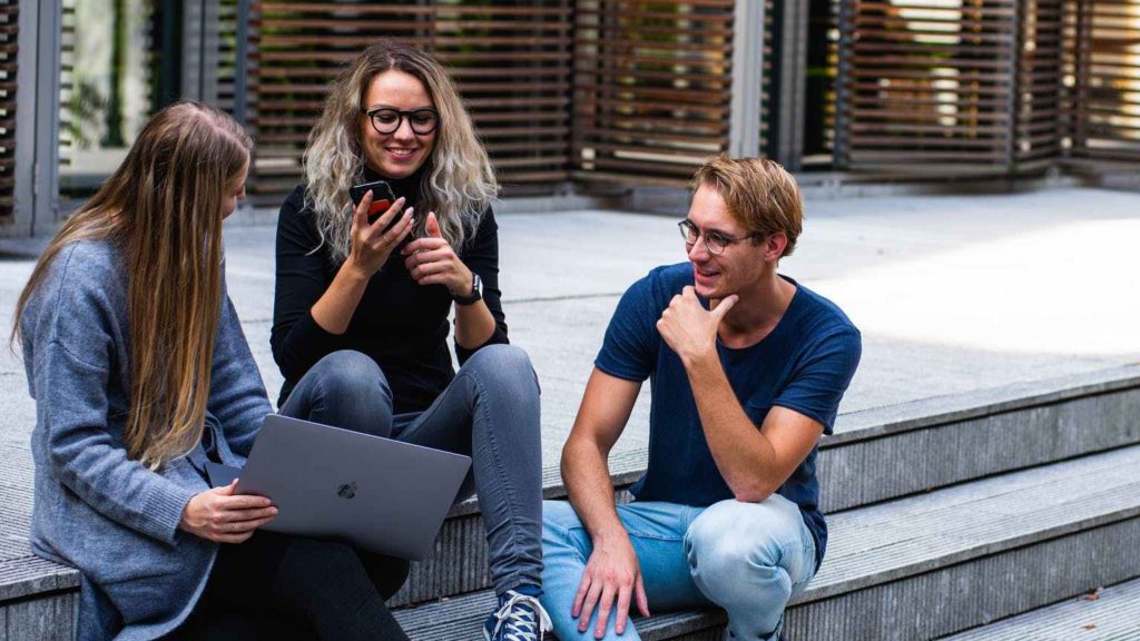 a group of people sitting on steps