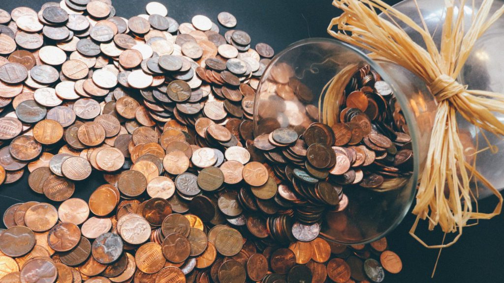 a glass jar full of coins