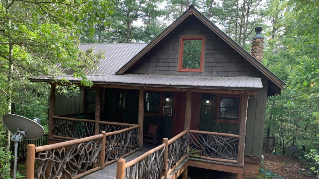 a house with a porch and a railing