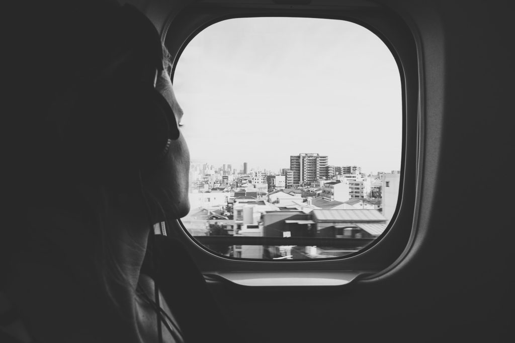 a woman looking out a window