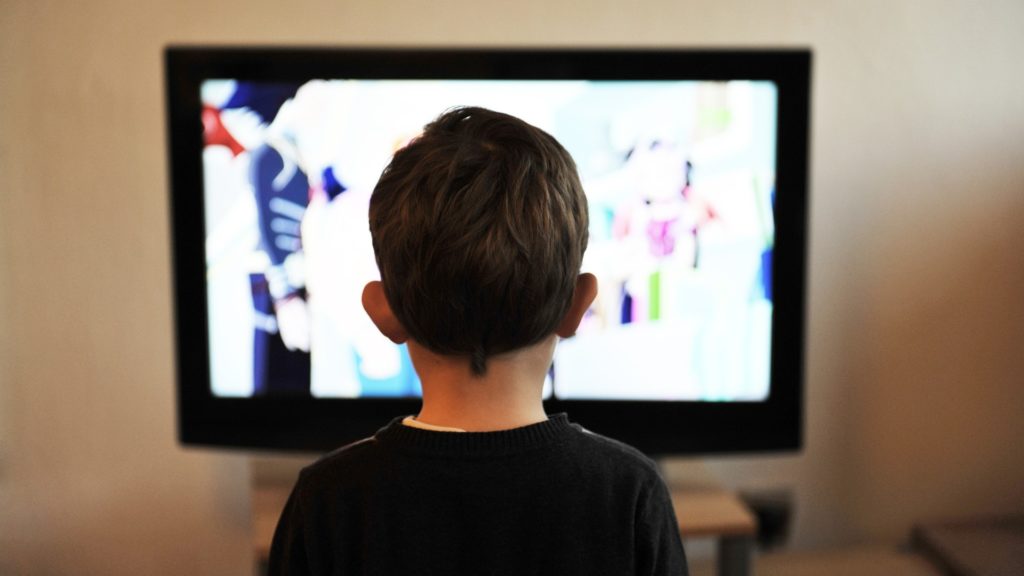 a child watching a television