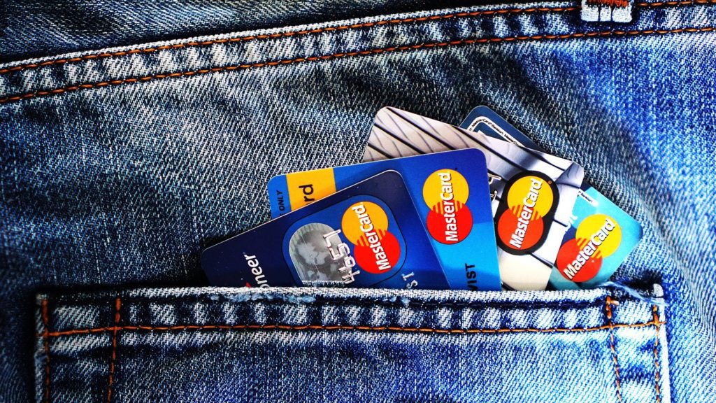 several credit cards in a pocket of jeans