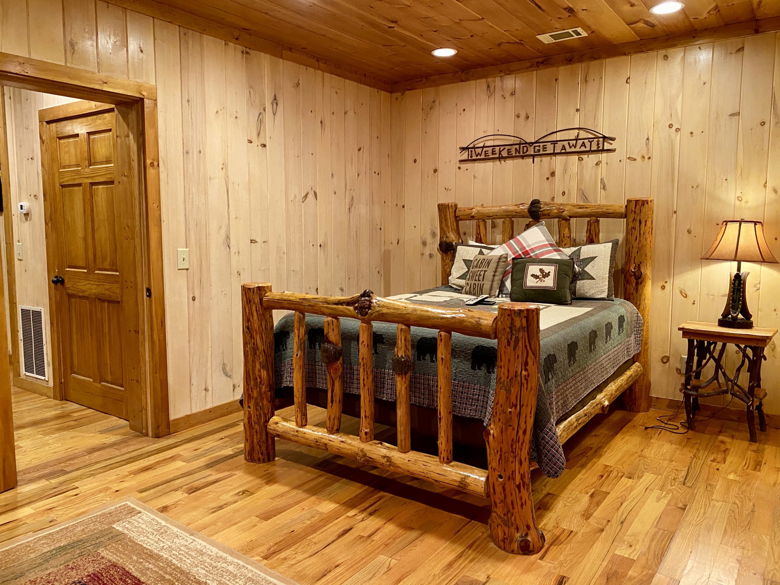 a wooden bed in a room