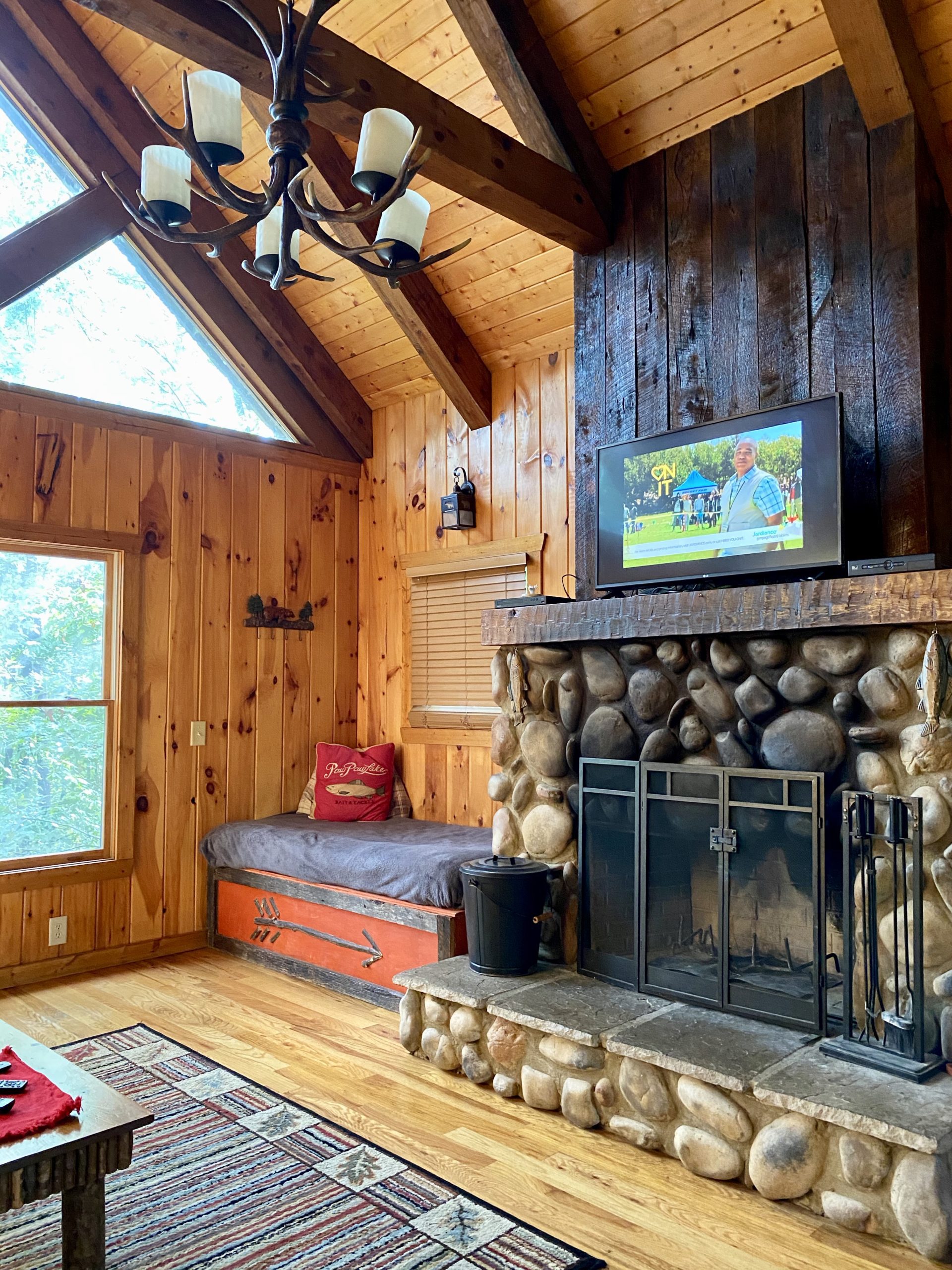 a fireplace in a log cabin