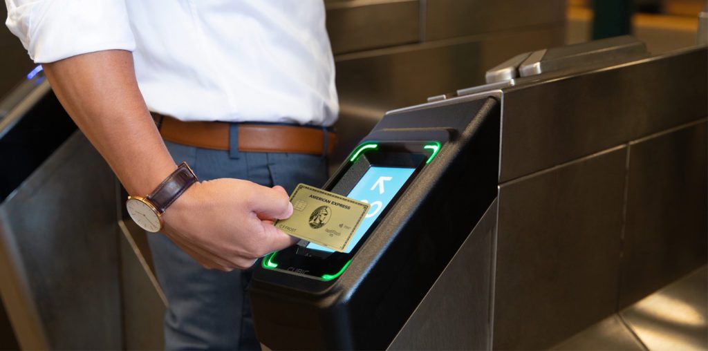 a person using a card to pay for a card