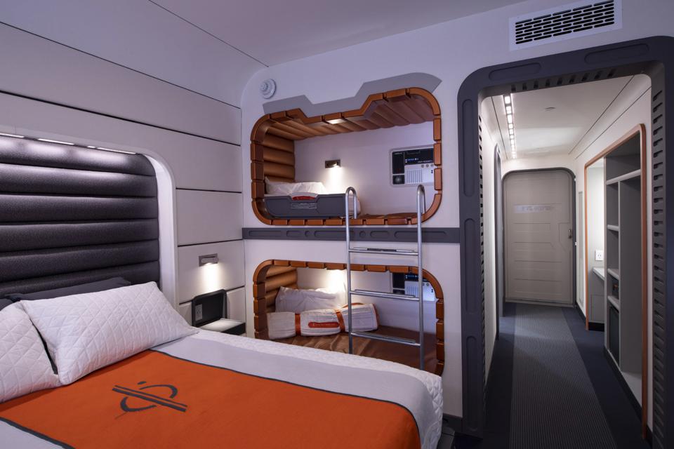 a room with bunk beds and a bed in it