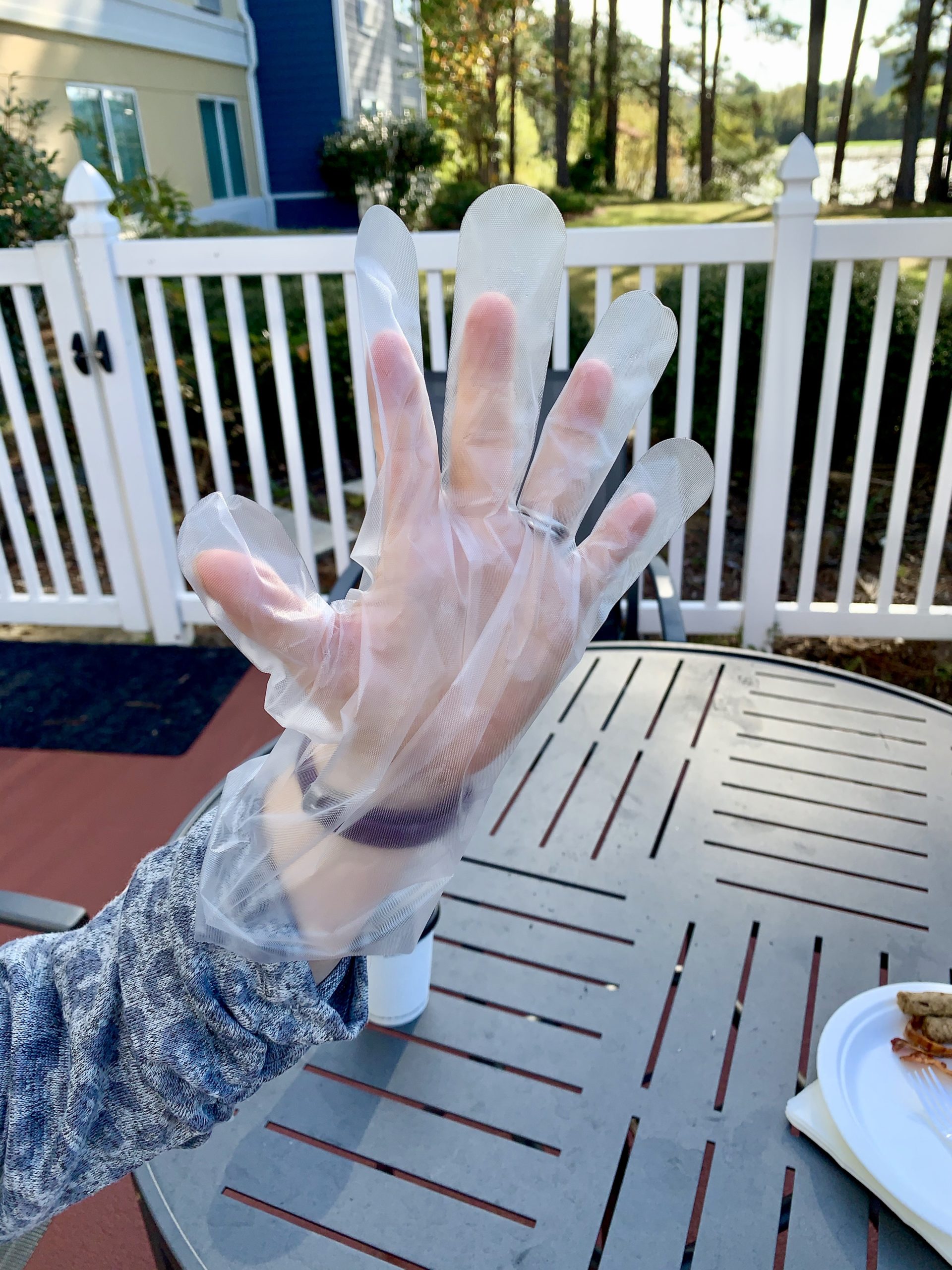 a hand in a plastic glove