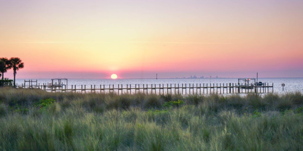 a sunset over a body of water