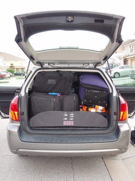 a car with luggage in the trunk