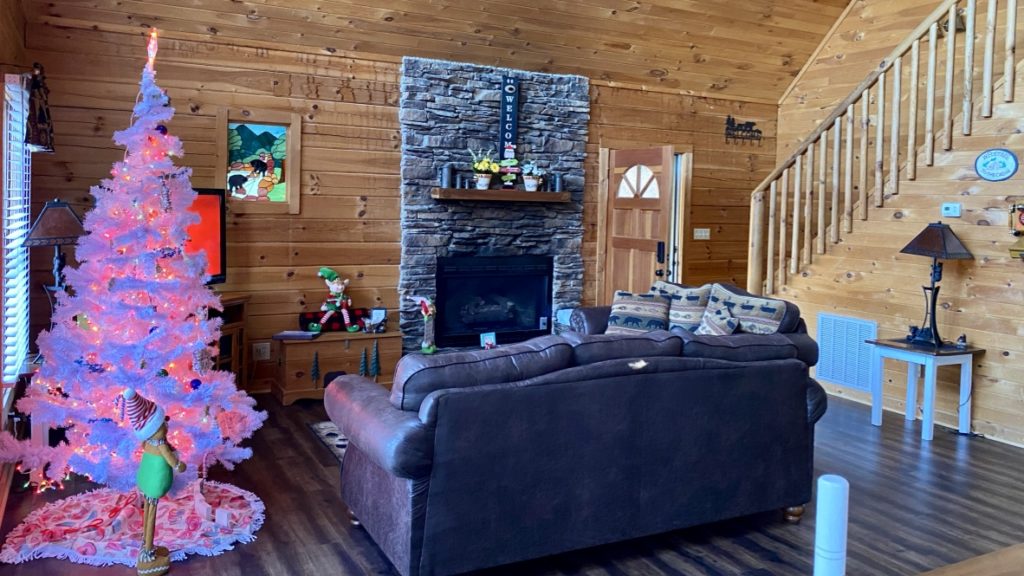 a living room with a fireplace and a couch