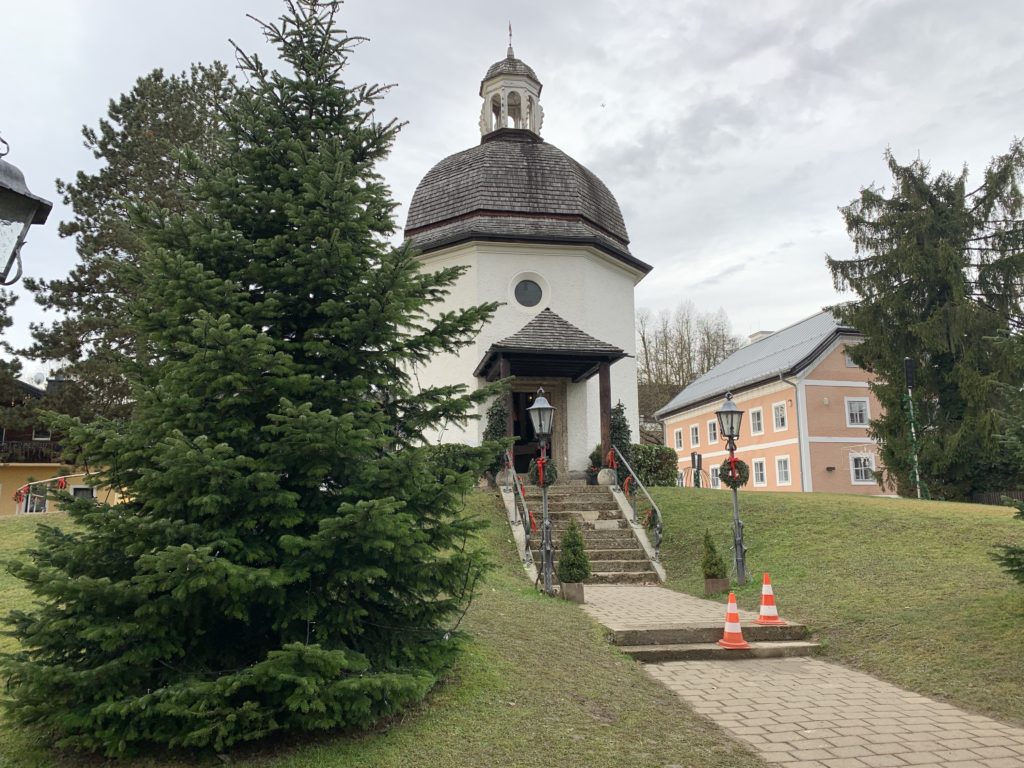 a building with a dome and stairs leading to it