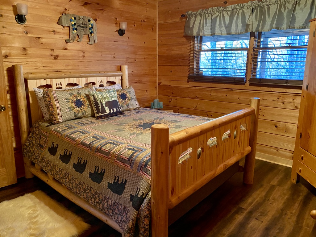 a bed in a log cabin