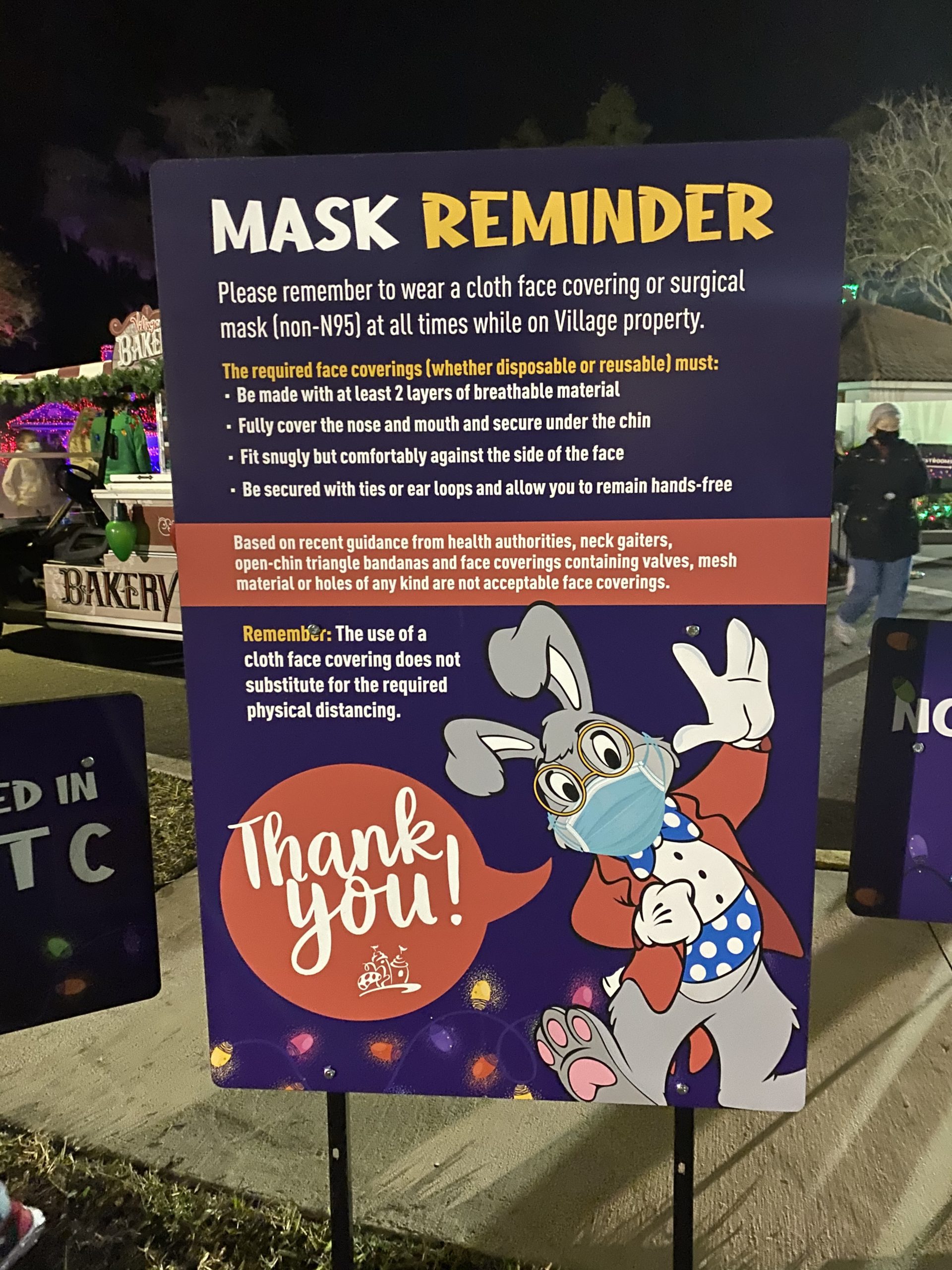 a sign with a mask on it