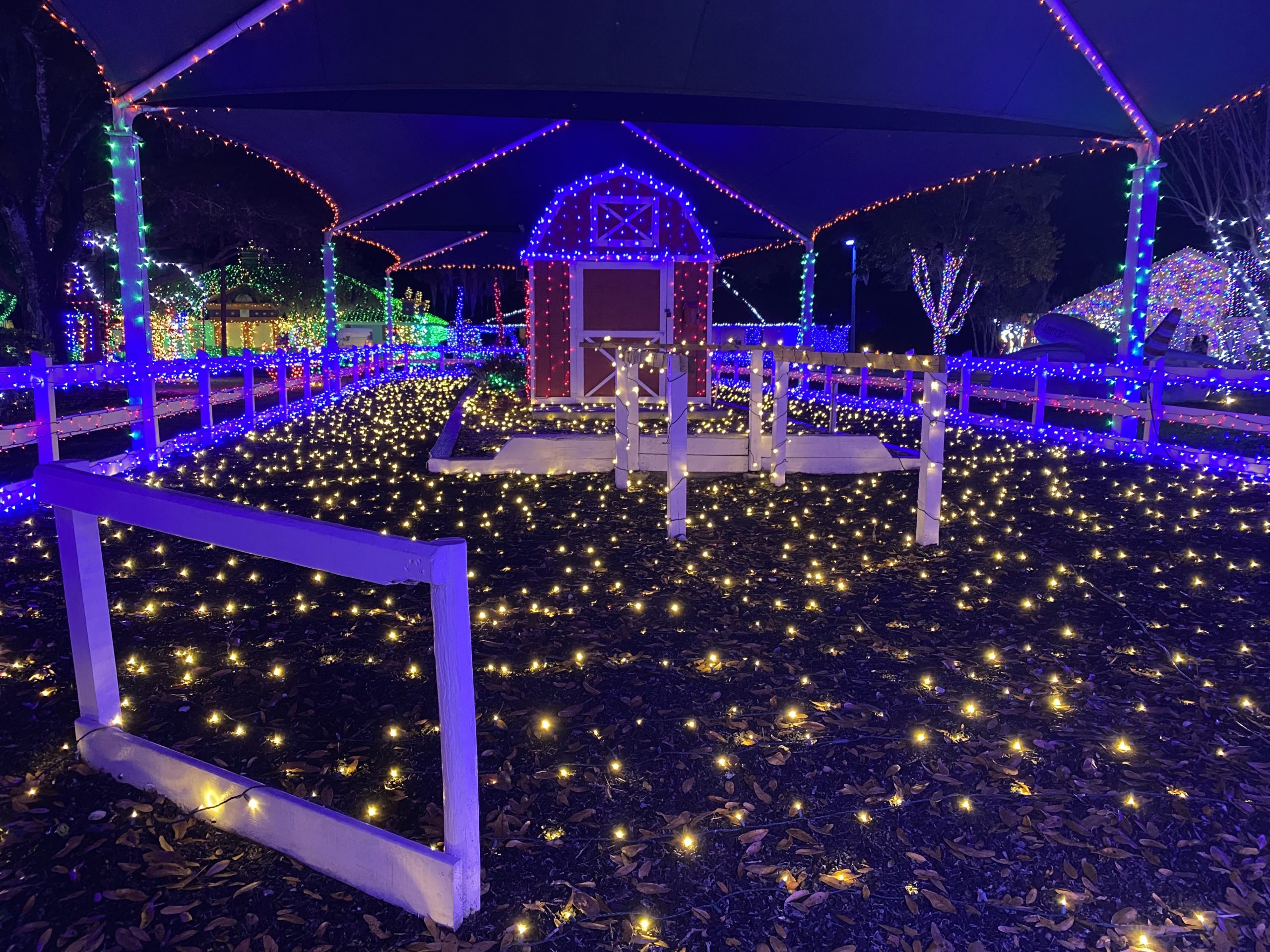a barn with lights on it