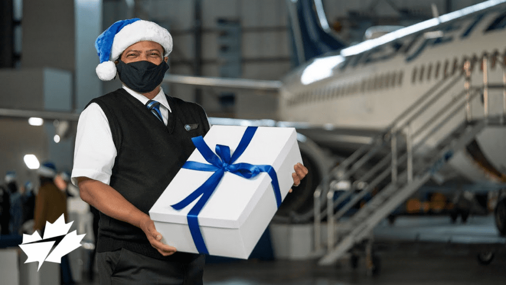 a man wearing a face mask and holding a gift box