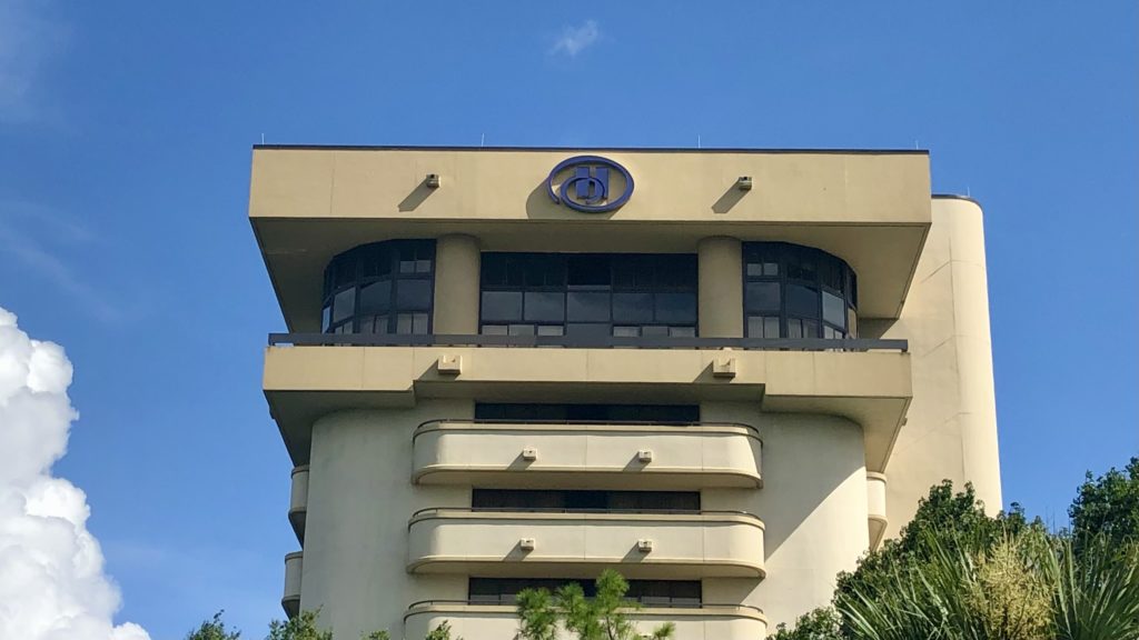 a building with a logo on top