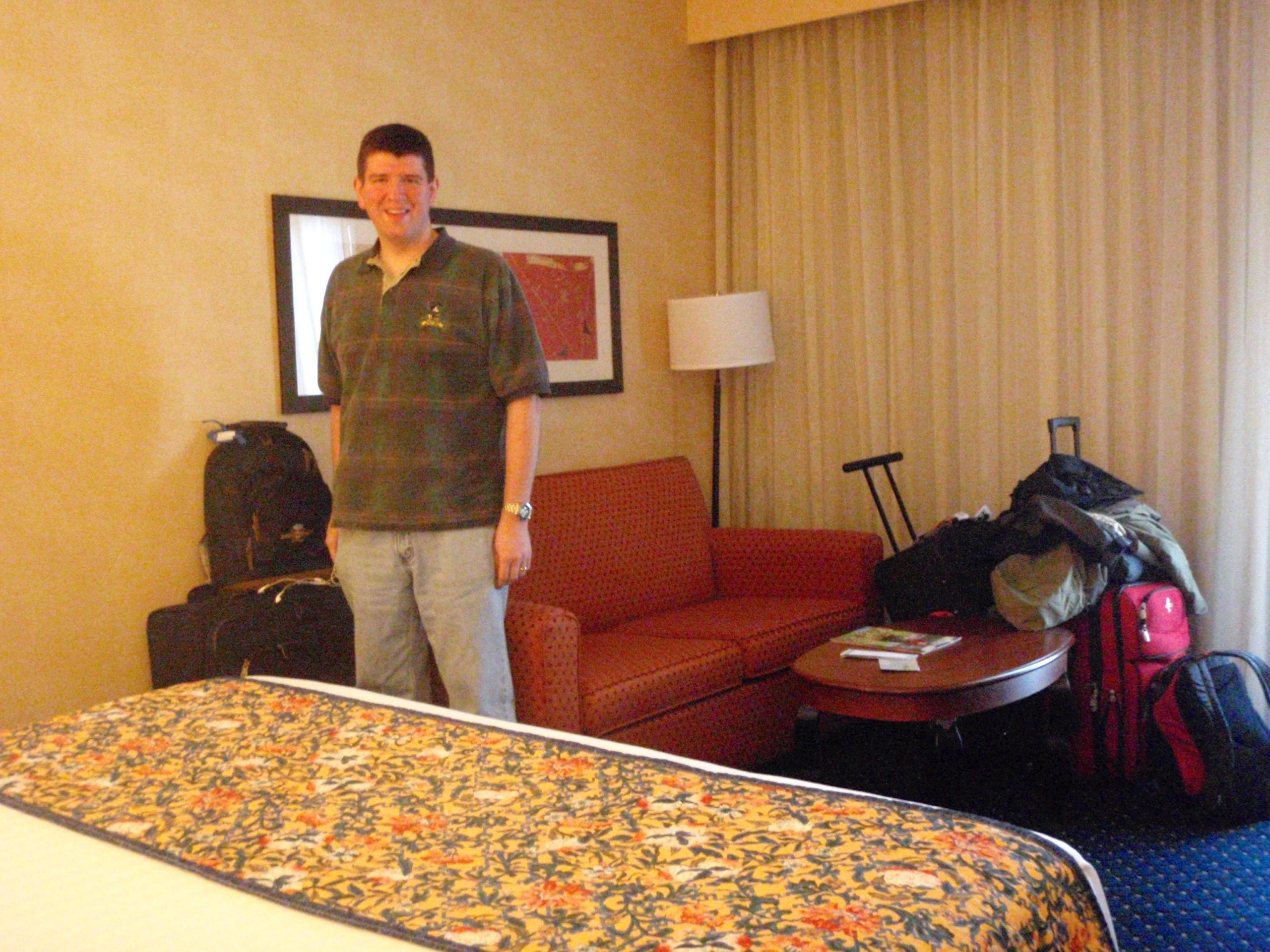 a man standing in a hotel room