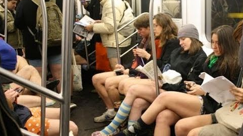 a group of people sitting on a subway