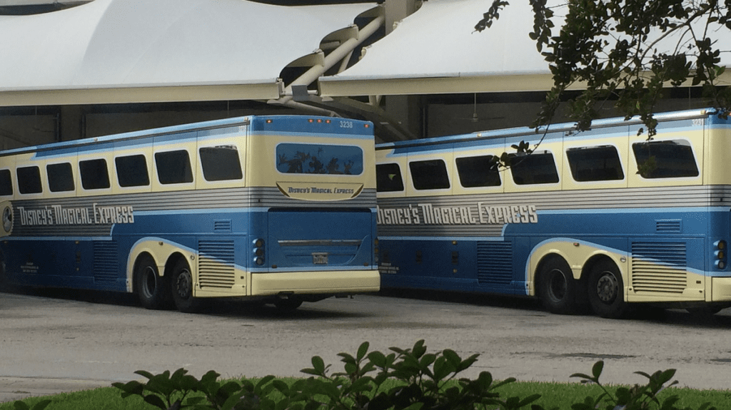 a two buses parked in a parking lot