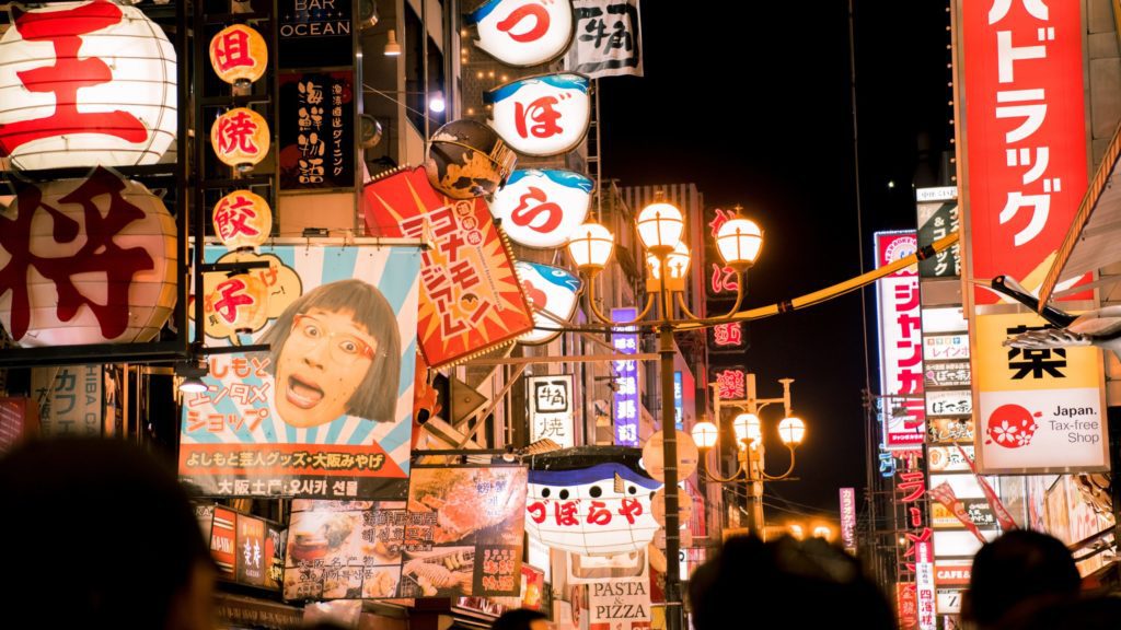 a street with signs and lights