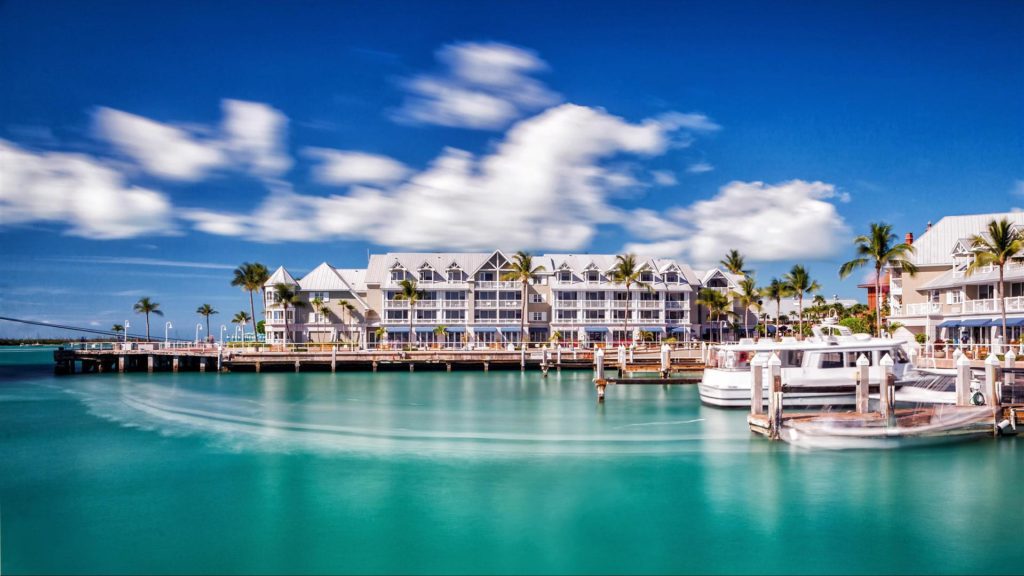 a body of water with a building and boats