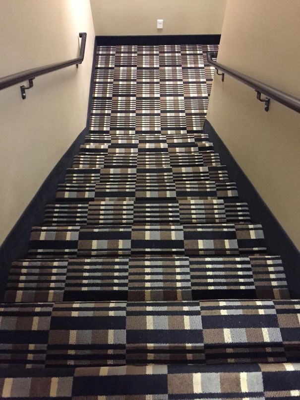a staircase with a carpeted stair case