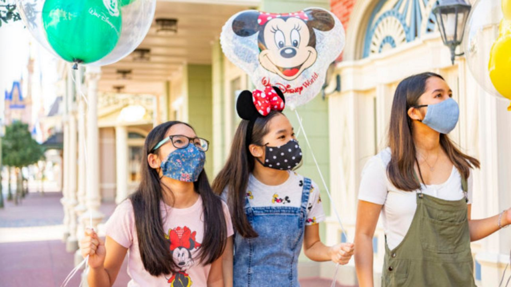 a group of girls wearing face masks