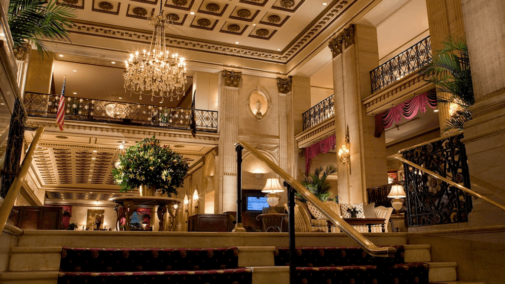 a large building with chandelier and stairs