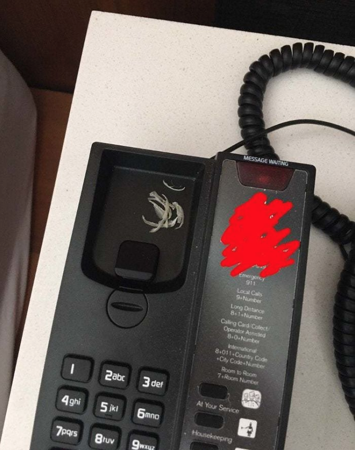 a telephone with a red stain on it