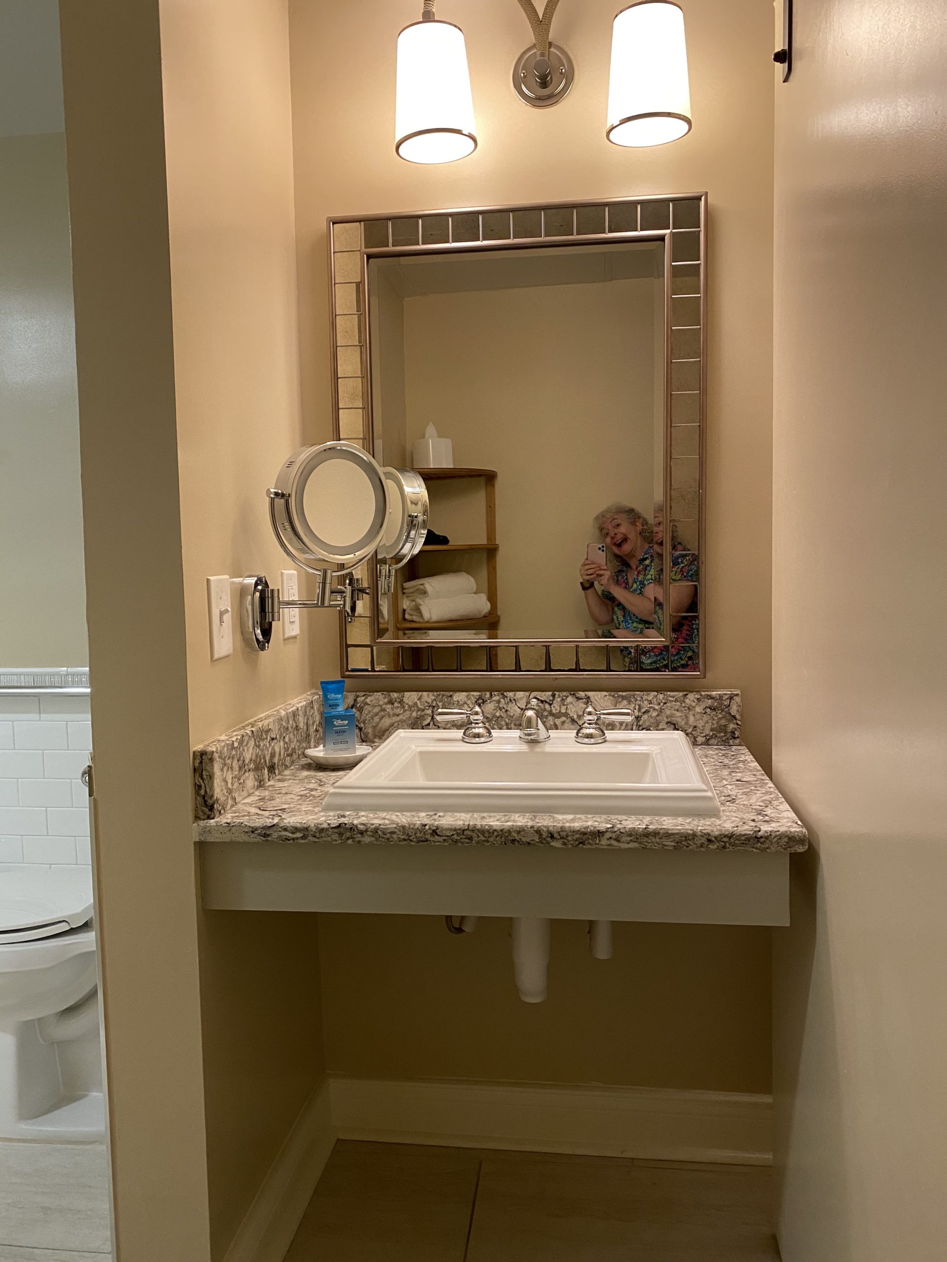a woman taking a selfie in a bathroom