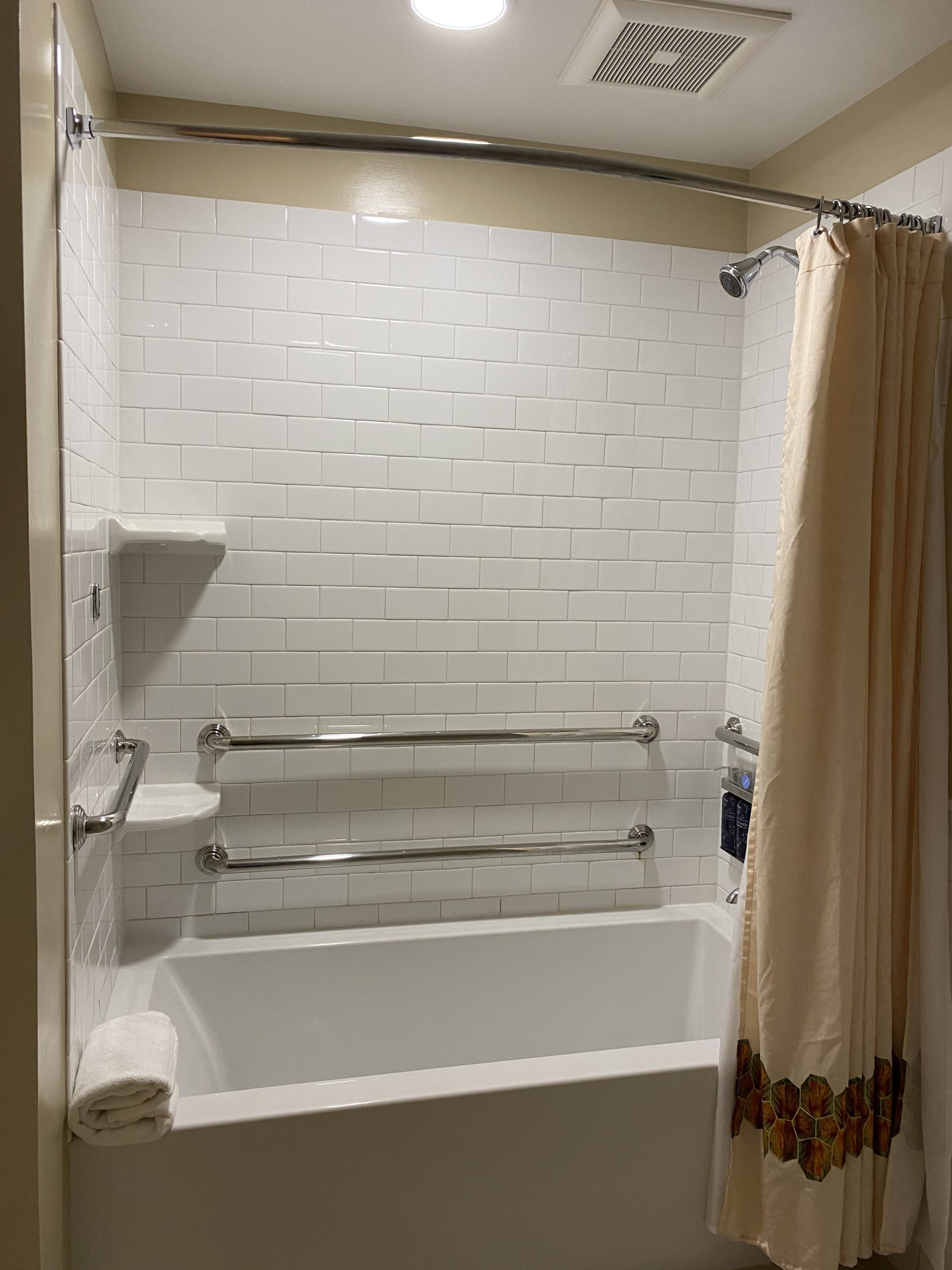 a shower curtain and tub