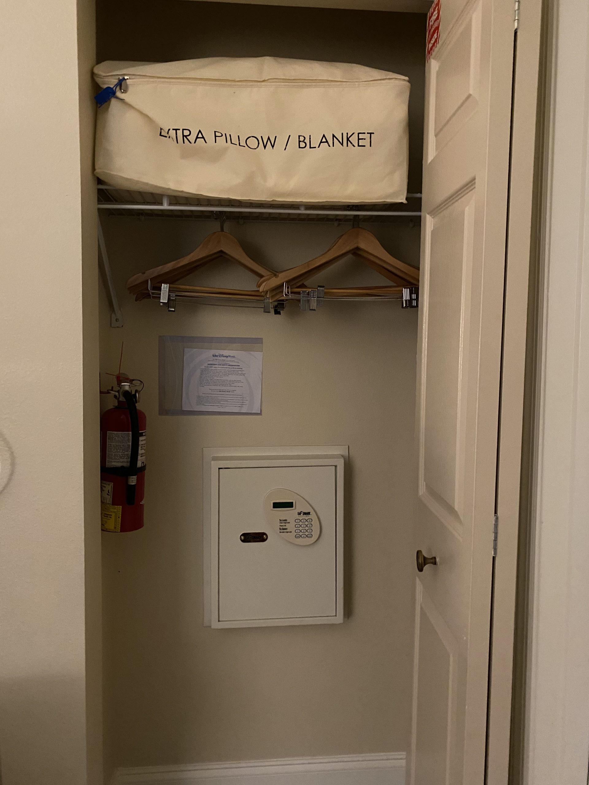 a closet with a white box and a white box with a white box on top