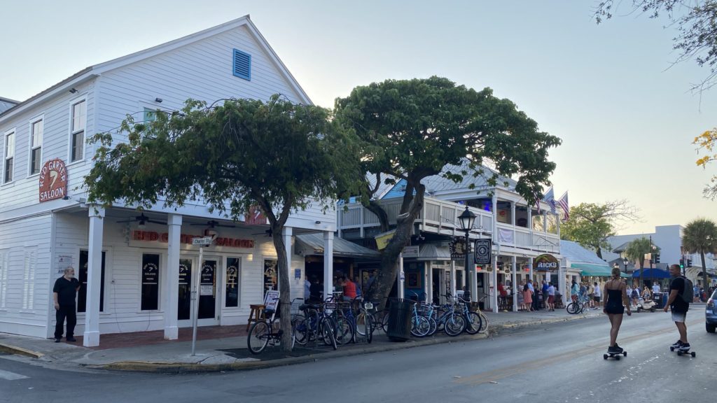 a group of people walking on a street